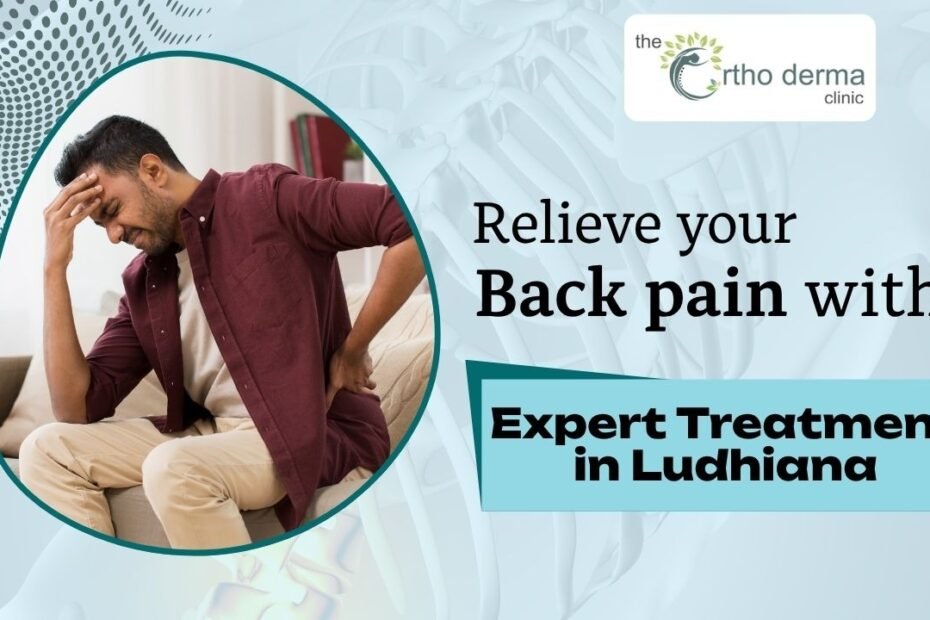 a man sitting and holding his lower back in pain